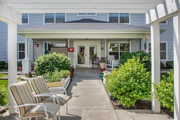 Entrance with a covered porch and seating area