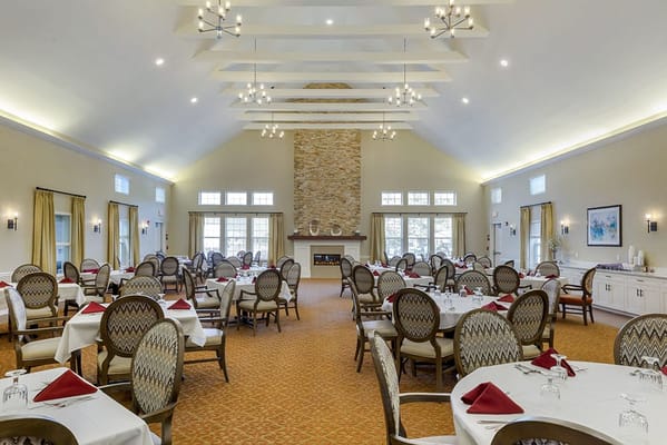 Elegant dining room with round tables set for meals