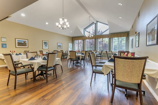 Bright dining area with tables and chairs