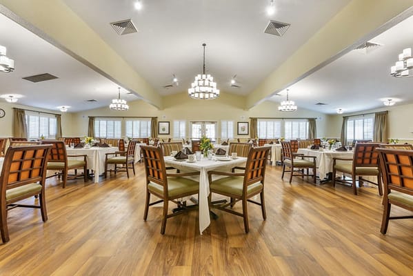 Dining room setup with tables and decorations