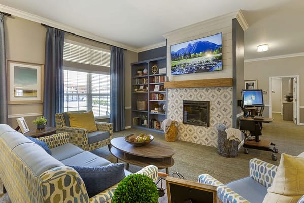 Cozy common area with seating and a fireplace