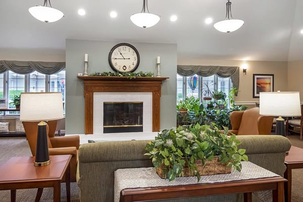 Cozy common area with a fireplace and plants