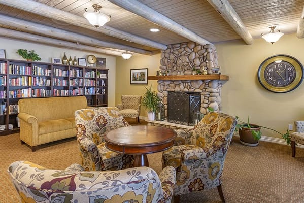 Cozy common area with seating and bookshelves