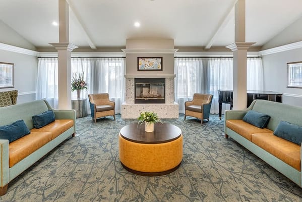 Cozy common area with sofas and a fireplace