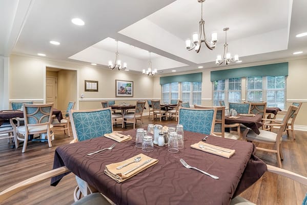 Well-set dining area with tables and chairs