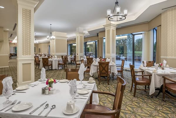 Elegant dining room setup with tables and chairs
