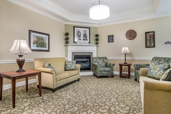 Cozy lounge area with seating and fireplace