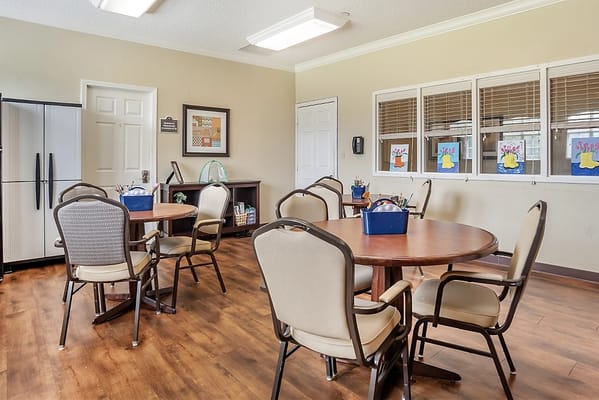 Bright activity room with seating and artwork