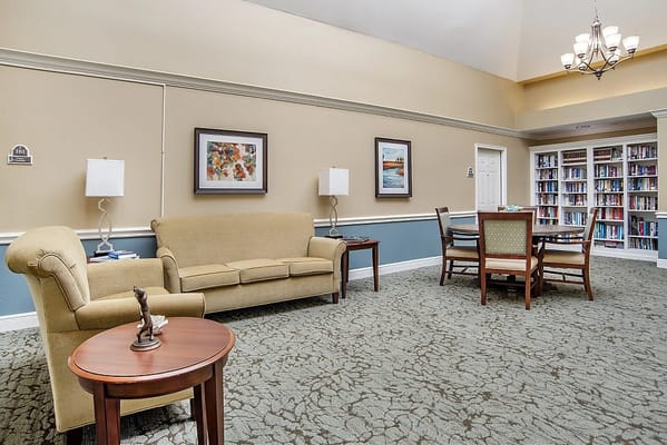Cozy common area with seating and bookshelves