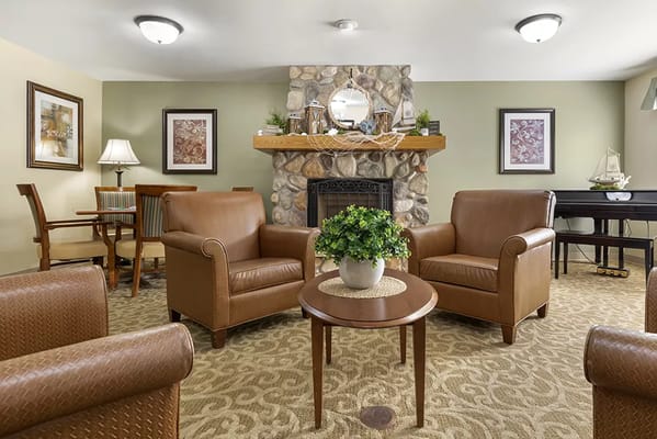 Cozy lounge area with comfortable seating and a fireplace