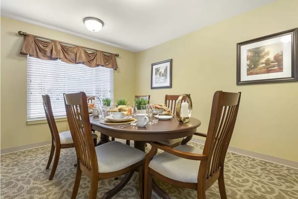 Dining room set with a meal prepared for residents