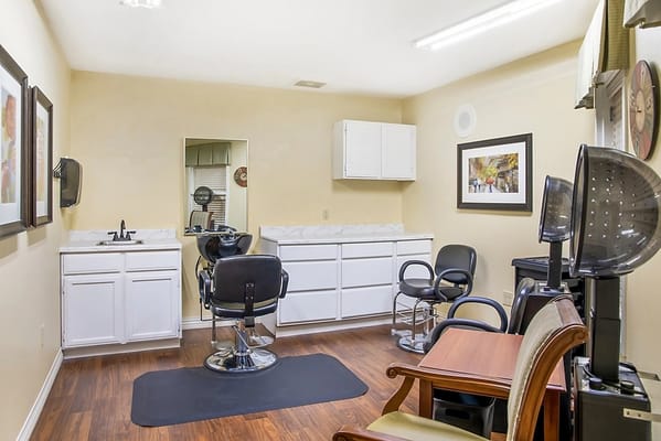 Salon area with styling chairs and mirrors