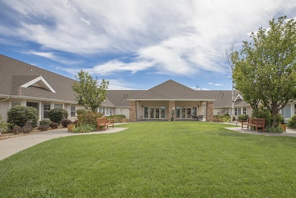 Outdoor view of the facility grounds with seating area