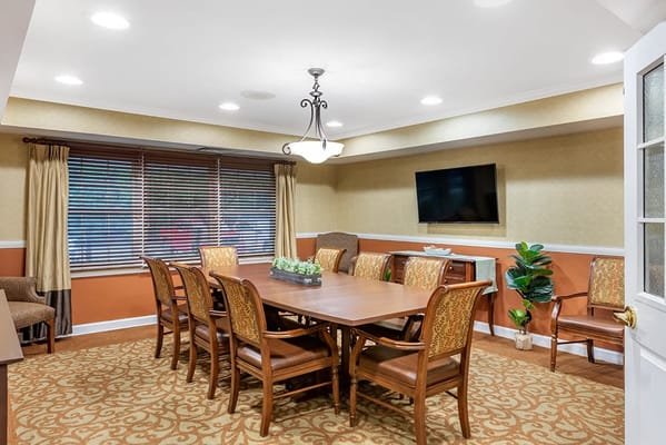 Bright common area with a large meeting table