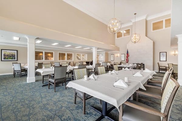 Dining area with neatly arranged tables and chairs
