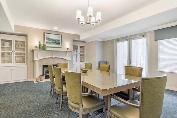 Spacious dining room with a large table and chairs