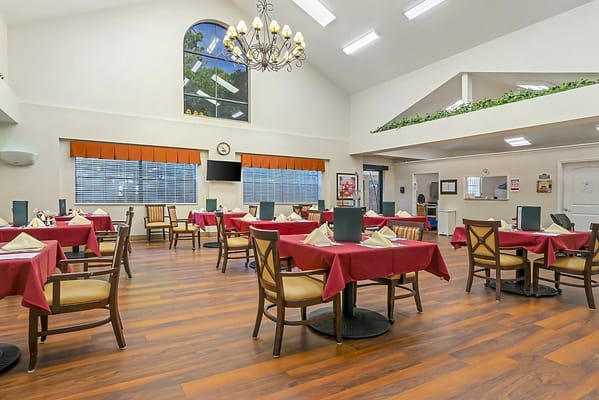 Bright dining room with tables set for meals