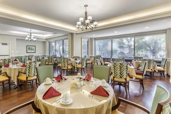Dining area with tables set for meal service