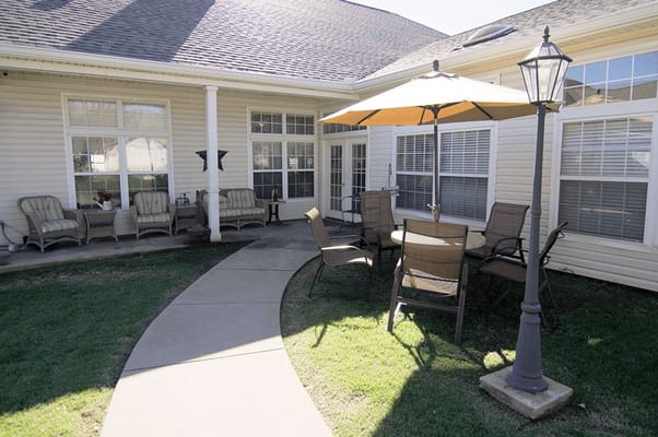 Outdoor patio with seating and umbrella