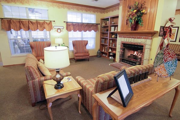 Cozy common area with seating and a fireplace