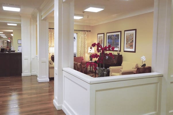 Bright common area with seating and floral decor