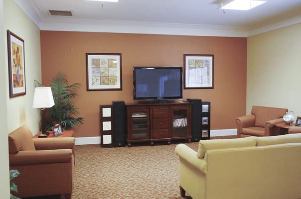 Cozy common area with seating and a TV