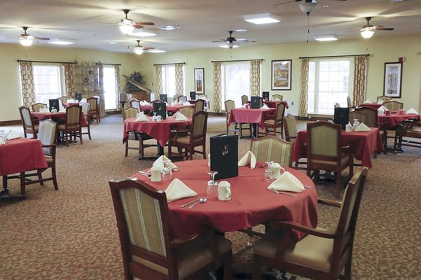 Dining room with neatly set tables and decor