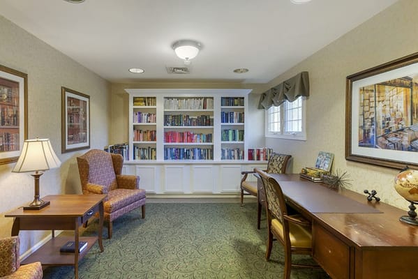 Cozy reading nook with bookshelves and seating