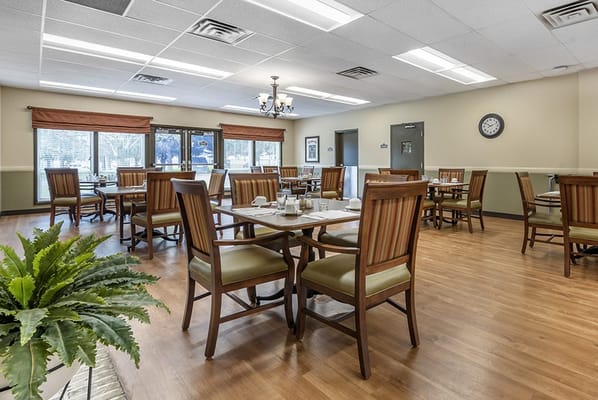 Dining room with tables and chairs ready for service