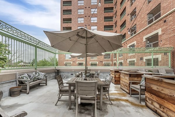 Outdoor seating area with tables and umbrellas