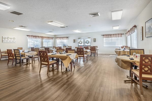 Bright dining area with tables set for meals