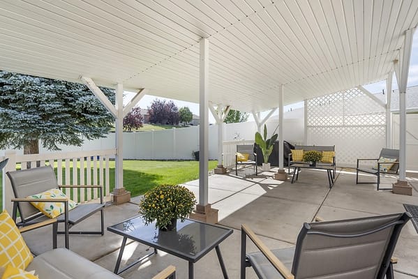 Covered outdoor seating area with comfortable chairs