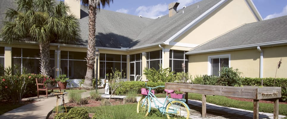 Outdoor garden area with colorful bicycle decor