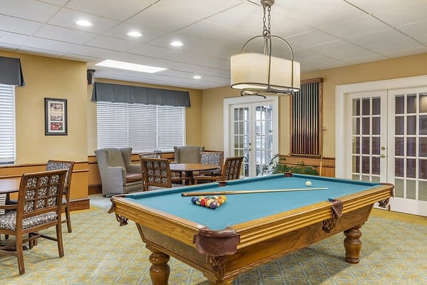 A well-furnished game room with a pool table