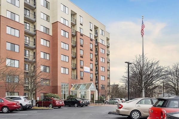 Exterior view of Brookdale Quincy Bay building with flag