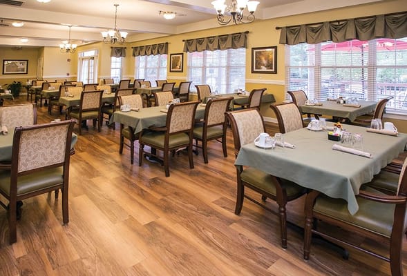 Bright dining area with tables set for meals