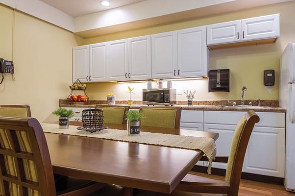 Bright interior kitchen area with dining table