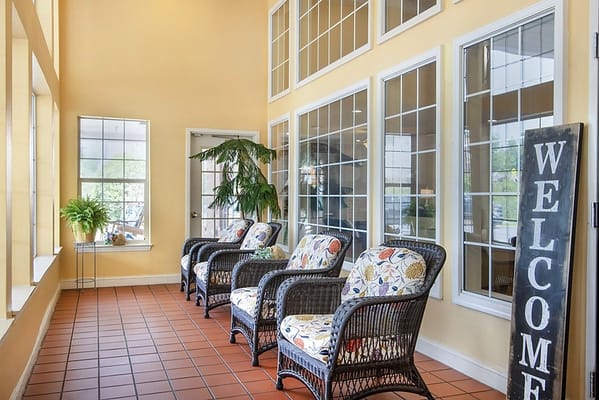 Bright interior lounge area with wicker chairs