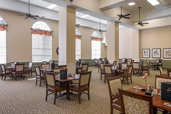 Dining room setup with tables and chairs