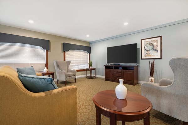 Cozy lounge area with comfortable seating and television