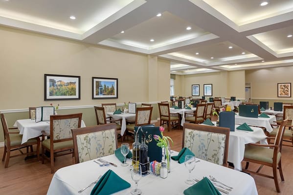 Dining room setup with tables and chairs