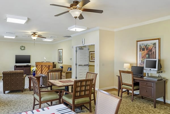 Common area with seating and computers for residents