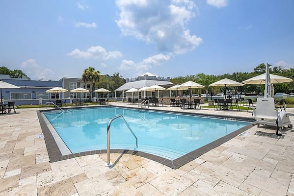 Pool area with umbrellas and seating
