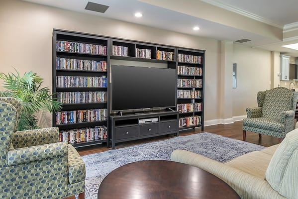 Common area with a media shelf and seating