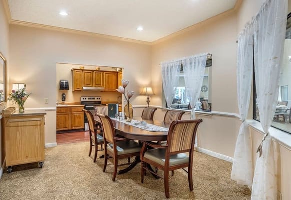 Dining area with a large table and chairs