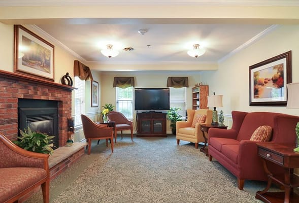 Cozy common area with seating and a fireplace