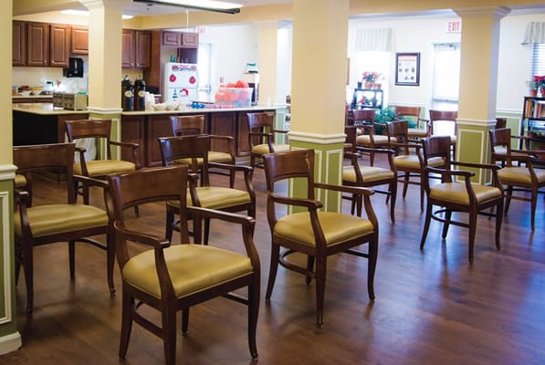 Empty common area with wooden chairs arranged