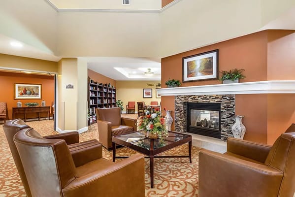 Cozy common area with comfortable seating and decorative fireplace