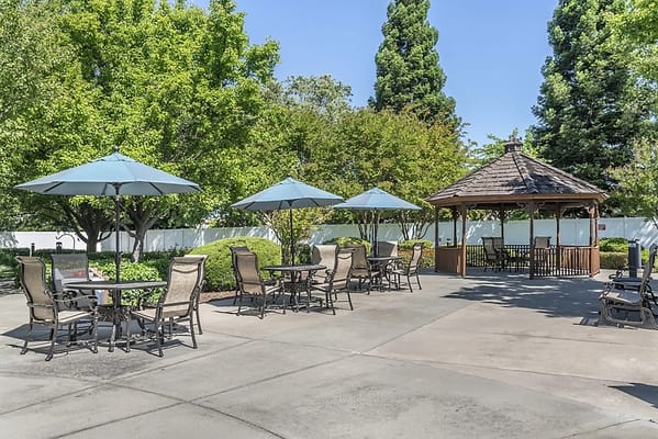 Outdoor seating area with umbrellas and gazebo