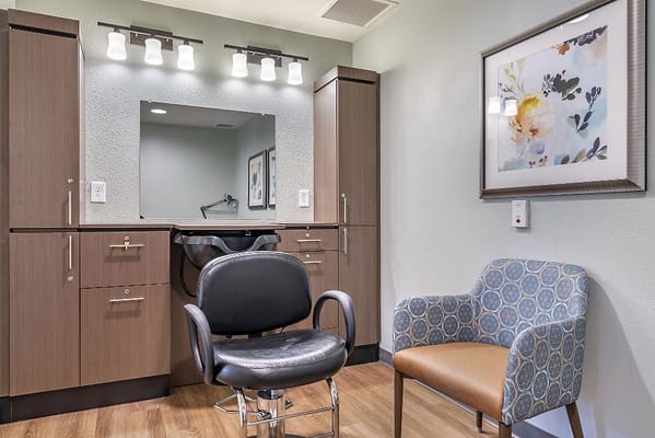Interior view of a salon area with styling chair